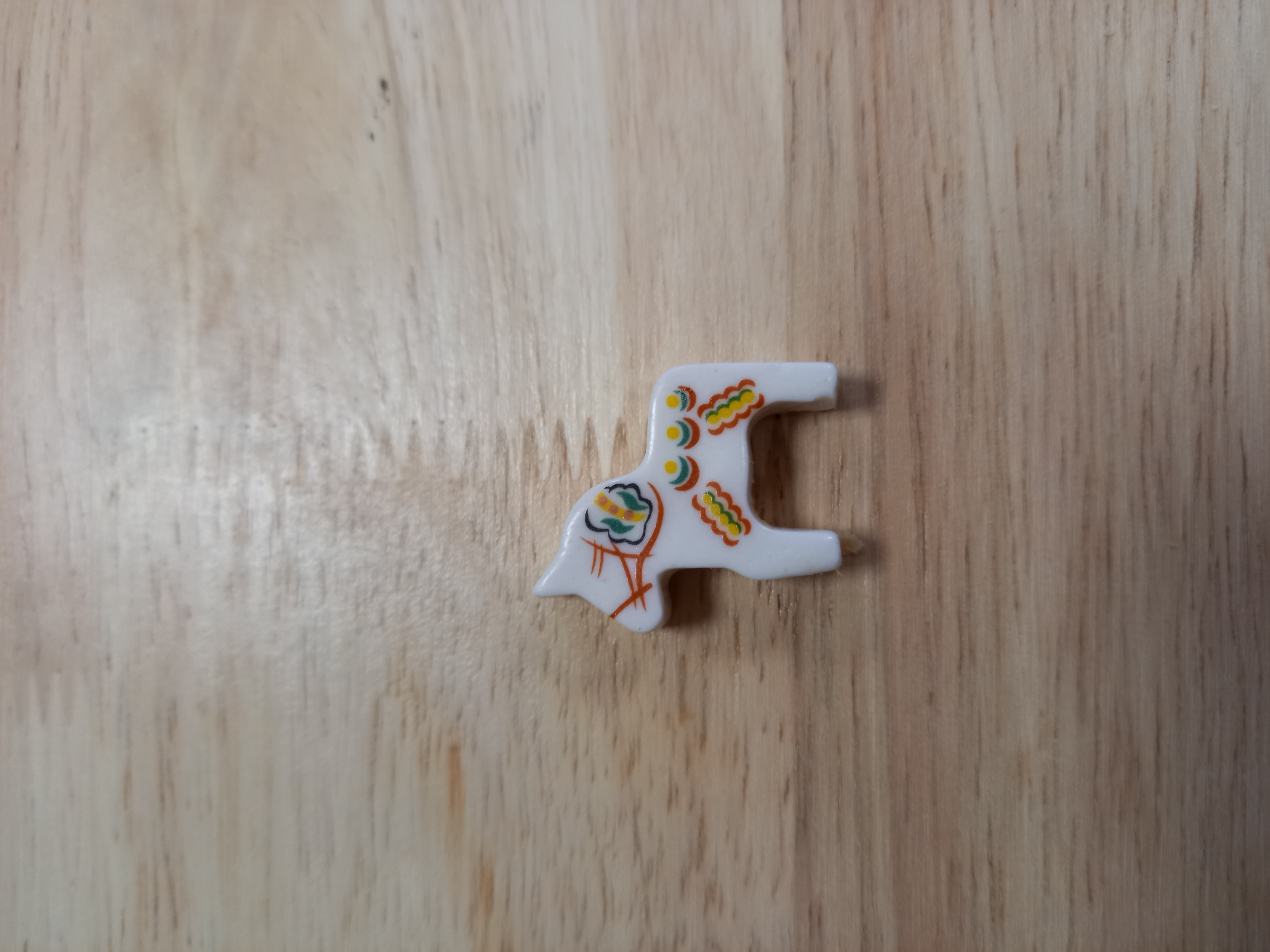 Photo d'une fève en forme de cheval coloré